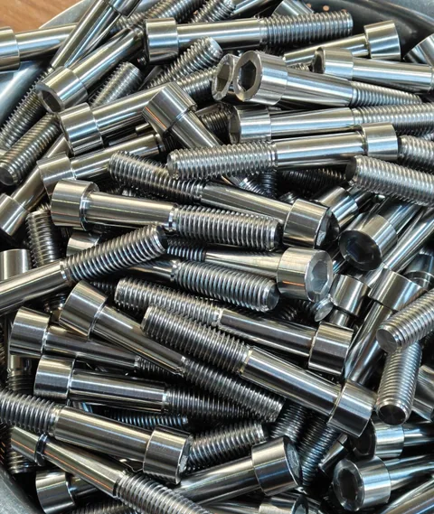 Titanium socket-head bolts showing smooth shanks and external threads
