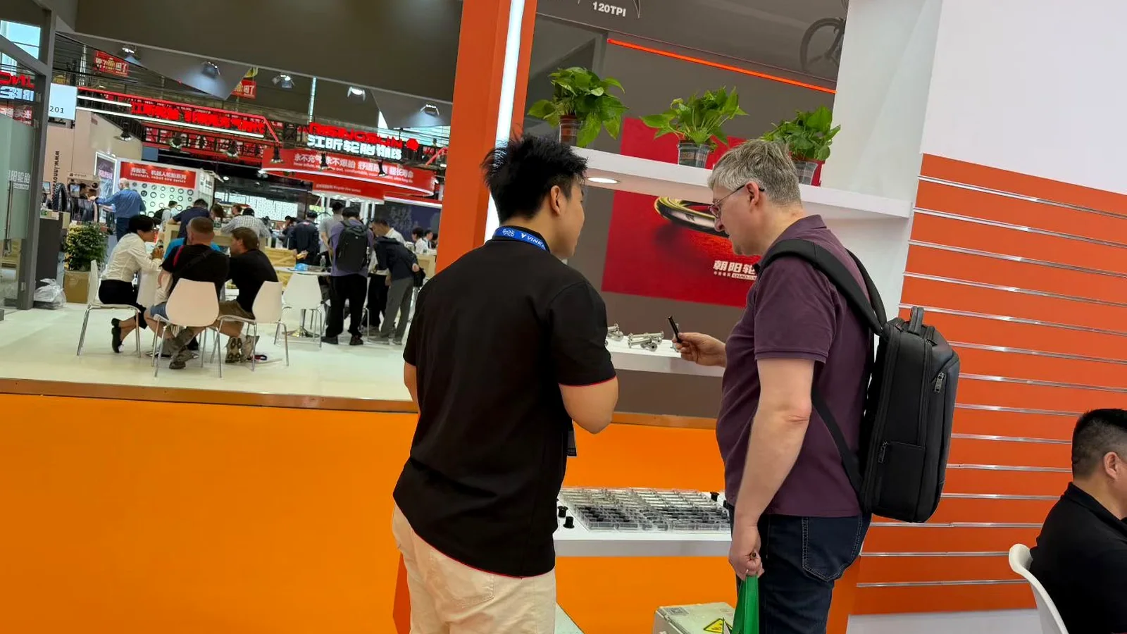Customer consultation at the PremFixer bicycle hardware booth
