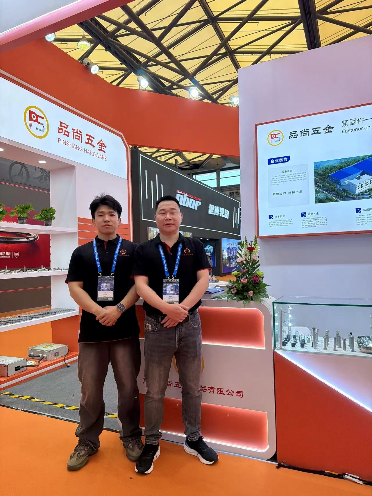 Two PremFixer team members at the Pinshang Hardware exhibition booth