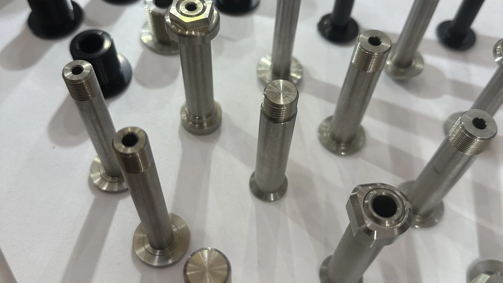 Production samples of bicycle shoulder bolts and custom axle hardware
