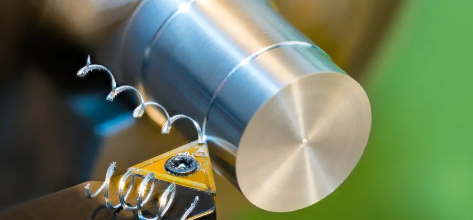 Close-up of lathe turning aluminum alloy