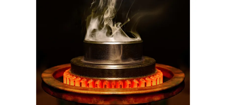 Red hot metal gear fresh from forging